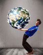 Good-looking man holding 3d planet earth