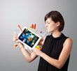 woman holding modern tablet with colorful diagrams and graphs