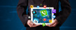 Businessman holding a tablet with modern colorful apps and icons