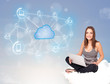 Photo: Happy woman sitting on cloud with cloud computing Happy woman sitting on cloud with cloud computing