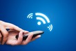 Hand holding smartphone with NFC technology - near field communi