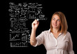 Woman drawing business scheme and icons on whiteboard