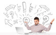 Young businessman brainstorming with drawn arrows and symbols