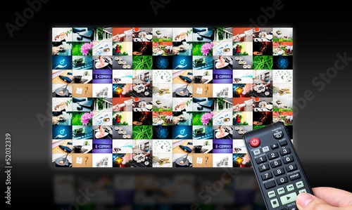 Photo: Remote control with virtual multimedia screen in background. Bla Remote control with virtual multimedia screen in background. Bla