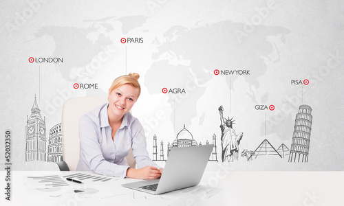 Photo: Beautiful businesswoman with world map and major landmarks of th Beautiful businesswoman with world map and major landmarks of th