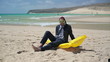 Happy businessman in diving mask on the beach