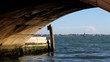 View to boats in Venice from under a bridge