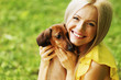 Foto: woman dachshund in her arms woman dachshund in her arms