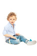 Beauty boy sitting on floor