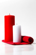 red and white candle on a white background