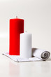 red and white candle on a white background