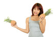 Photo: Isolated young asian woman with pineapple Isolated young asian woman with pineapple