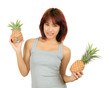 Photo: Isolated young asian woman with pineapple Isolated young asian woman with pineapple