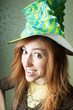 Funny clown girl with big hat smiling