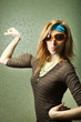 Funny sports girl in sunglasses with fake biceps