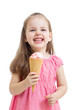 joyful child girl eating ice cream in studio isolated