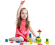 Foto: child girl playing with block toys over white background child girl playing with block toys over white background
