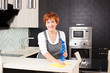 Woman cleaning kitchen