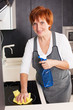 Photo: Woman cleaning kitchen Woman cleaning kitchen