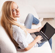 Woman on the sofa with laptop