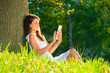 Close up portrait of young female with tablet pc.