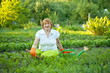 Happy mature woman working in garden