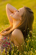 Portrait of the beautiful girl lying on the meadow