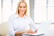 Photo: Young business woman using laptop Young business woman using laptop