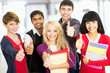 Students giving the thumbs-up sign