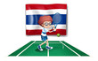 A boy playing tennis in front of the Thailand flag