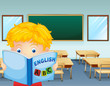 A kid reading inside the classroom