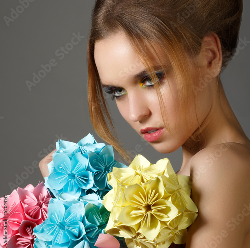 Photo: Beautiful Bright Woman holding Bouquet of Paper Origami Flowers Beautiful Bright Woman holding Bouquet of Paper Origami Flowers
