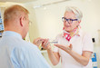 Customer buying glasses at optician