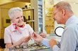 Customer looking for glasses at optician