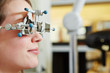 Woman at optician with trial frame