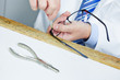 Optician with glasses and screwdriver