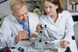 Woman as apprentice in optician workshop
