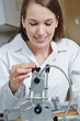Woman at drilling machine in apprenticeship