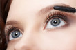 Photo: beautiful woman applying mascara beautiful woman applying mascara