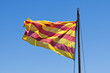 Catalan flag waving against blue sky