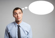 Handsome young business man thinking. Space for text
