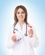 Young attractive female doctor isolated on white