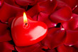 Foto: Heart red candle and rose petals Heart red candle and rose petals