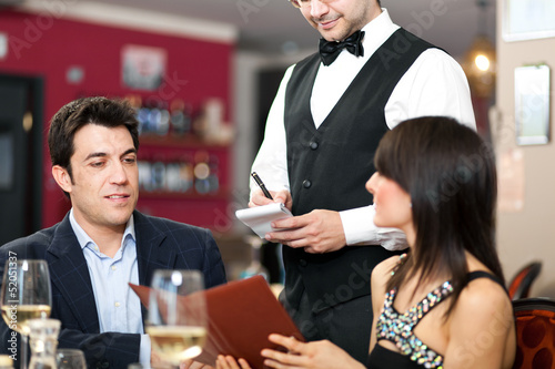 Photo: Couple having dinner in a luxury restaurant Couple having dinner in a luxury restaurant