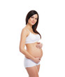 Young attractive pregnant woman with the beautiful belly
