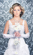 Photo: Young, beautiful and emotional bride with flowers Young, beautiful and emotional bride with flowers