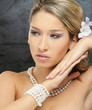Portrait of young and beautiful woman over dark background