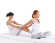 Photo: Young woman getting traditional thai stretching massage Young woman getting traditional thai stretching massage