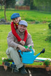 Gardening, planting - girl helping father in the garden