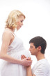 Young attractive couple: pregnant mother and happy father isolat